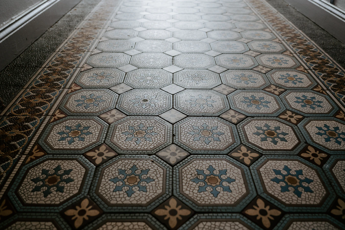 Flower mosaic tiling with a combination of octagonal and diamond shaped tiles